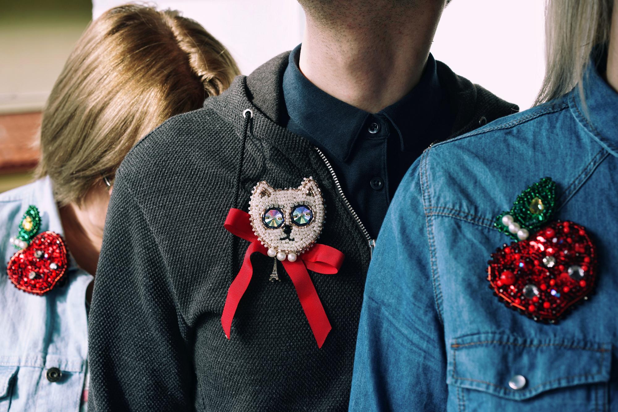 Corporate lapel pin embroidered on felt